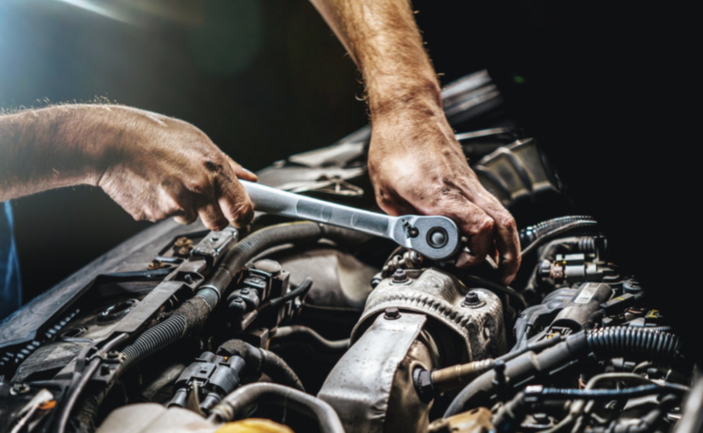 Huntington Beach mobile mechanic inspecting an engine